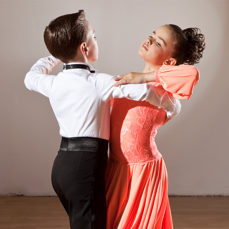 young boy and girl dancing